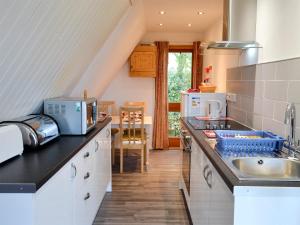a kitchen with a sink and a counter top at Bay View in Kingsdown