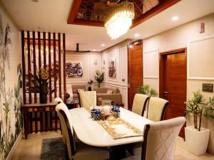 a dining room with a table and chairs at MG Luxury Stays - Entire 4 BHK in Panchkula