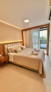 Postel nebo postele na pokoji v ubytování JC Life Residence