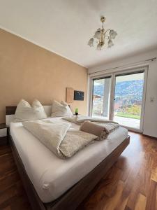 Postel nebo postele na pokoji v ubytování Bergzauber Appartement Stubai