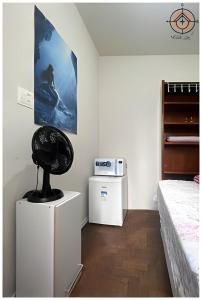 Ένα ή περισσότερα κρεβάτια σε δωμάτιο στο Avenida Paulista Quarto Privado Independente