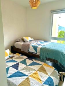 Postel nebo postele na pokoji v ubytování Charming Apartment in Curridabat