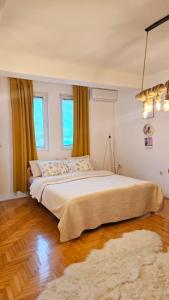 a bedroom with a large bed and a rug at Jana's Apartment,100 meters to the lake,Free Parking in Ohrid