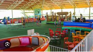 an indoor playground with a water park with children playing at Flat 718, Villa hípica, Gravatá in Gravatá