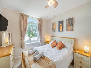 En eller flere senge i et værelse på Boohay - Bay Fort