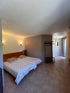 Postel nebo postele na pokoji v ubytování Gîtes de la chocolaterie