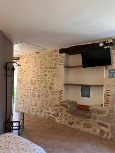 TV a/nebo společenská místnost v ubytování Gîtes de la chocolaterie