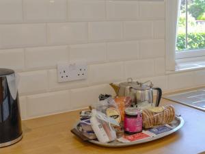 a tray of food sitting on a kitchen counter at Rotherwood in Portinscale +8 photos