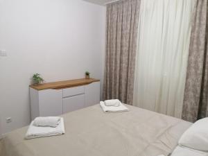 Postel nebo postele na pokoji v ubytování Apartman atHOME