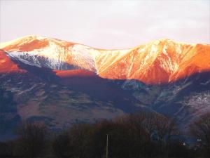 a view of a mountain with snow on it at Acorn Lodge - Burnside Park in Keswick