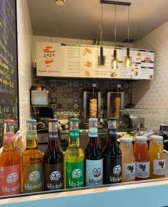 a row of bottles of drinks on a counter at Bobowianka in Bobowa