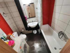 a bathroom with a sink and a toilet and a tub at Marlen House Chania in Chania
