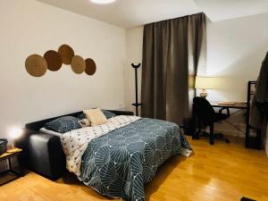 Postel nebo postele na pokoji v ubytování Coeur de ville - Spacieux 2 chambres + 5 fotografií