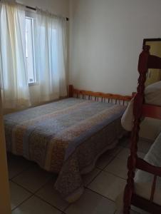 Ένα ή περισσότερα κρεβάτια σε δωμάτιο στο Casa férias em torres