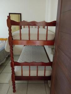 Ένα ή περισσότερα κρεβάτια σε δωμάτιο στο Casa férias em torres