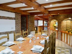a large room with a long table and chairs at The Farmhouse - Ukc1339 in North Molton