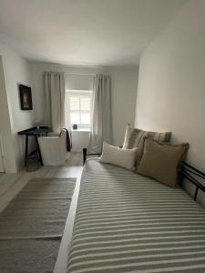 a living room with a couch and a window at Landhaus Johann in Mürzzuschlag