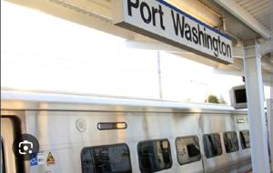 a train at a train station with a sign that reads fort westminster at Cozy 4BR 3BA Home- Train to NYC, USOpen, CitiField Mets, Walk to Harbor & Golf in Port Washington