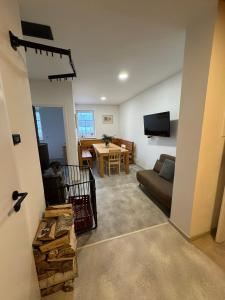 a living room with a couch and a table at Chaloupka Příchovice in Kořenov +7 photos