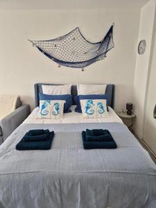 Ένα ή περισσότερα κρεβάτια σε δωμάτιο στο Le Lagon