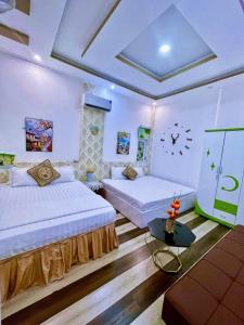 Un pat sau paturi într-o cameră la Hoàng Nga Apartment Phan Thiết