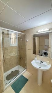 a bathroom with a shower and a sink at Apartamentos Tahiche in Costa Teguise