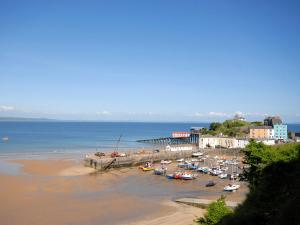 a group of boats are parked on the beach at Ty Mair in Tenby