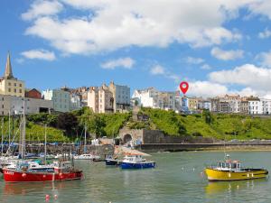 a group of boats sitting in the water in a harbor at Ty Mair in Tenby