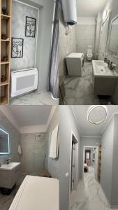 a bathroom with two sinks and a toilet at Luxury Apartment Orikum in Orikum