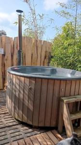 a hot tub sitting on top of a wooden deck at Dôme étoilé in Pléneuf-Val-André +1 photo