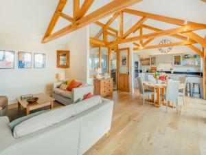 a living room with a couch and a table at Windover Barn in Slinfold +31 photos