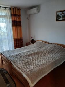 Postel nebo postele na pokoji v ubytování Maja Apartman