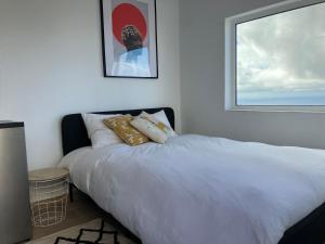 Ένα ή περισσότερα κρεβάτια σε δωμάτιο στο Ocean Studio