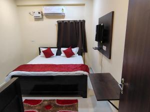 Ένα ή περισσότερα κρεβάτια σε δωμάτιο στο Krishna Bilas