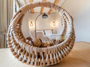 a wicker basket with a bed in a bedroom at Casa Breslelor in Sibiu +219 photos