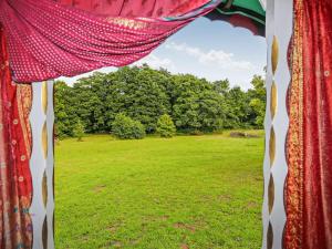 a view of a field from a window at Copperbeech Bowtop in Tilston