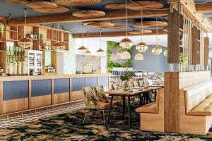 a restaurant with a table and chairs and a bar at 3 bedroom Heaven Home in Chichester