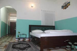 Ένα ή περισσότερα κρεβάτια σε δωμάτιο στο Morning Mist Home stay