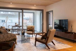 Un televizor și/sau centru de divertisment la The Address near Zurich- stylish and comfortable