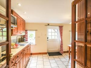 Køkken eller tekøkken på The Old Coach House -Uk41272