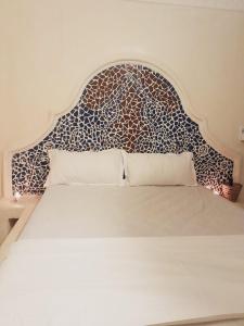 Ένα ή περισσότερα κρεβάτια σε δωμάτιο στο Villa Paradise