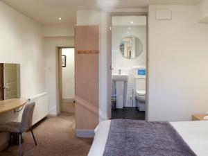 En eller flere senge i et værelse på 1 Brantfield House Bowness