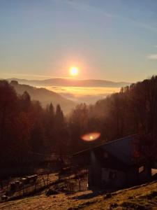 a sunset with the sun rising over a valley at Mała Bośnia in Bystrzyca Kłodzka +4 photos
