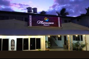 a sign on the side of a building at Matasawa Resort - Wailoaloa, Nadi in Nadi +2 photos