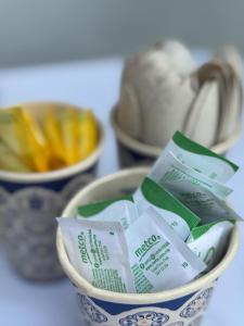 a bowl with packets of french fries in it at Hotel Mirador--gratis bicicletas in Bacalar