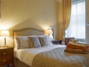 En eller flere senge i et værelse på Helens Lea