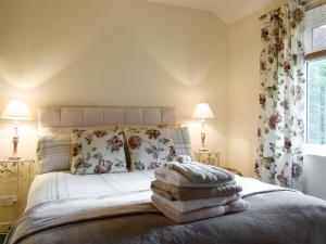 En eller flere senge i et værelse på Helens Lea