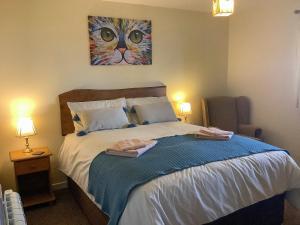 Postel nebo postele na pokoji v ubytování The Lodge