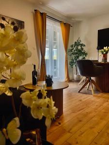 a living room with a table and a window at Filuma Suite with private terrace and balcony PANORAMIC GACKA VIEW in Otočac