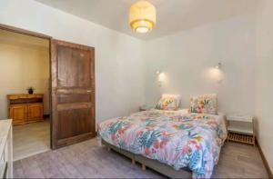 Voodi või voodid majutusasutuse Les pieds dans Lot toas